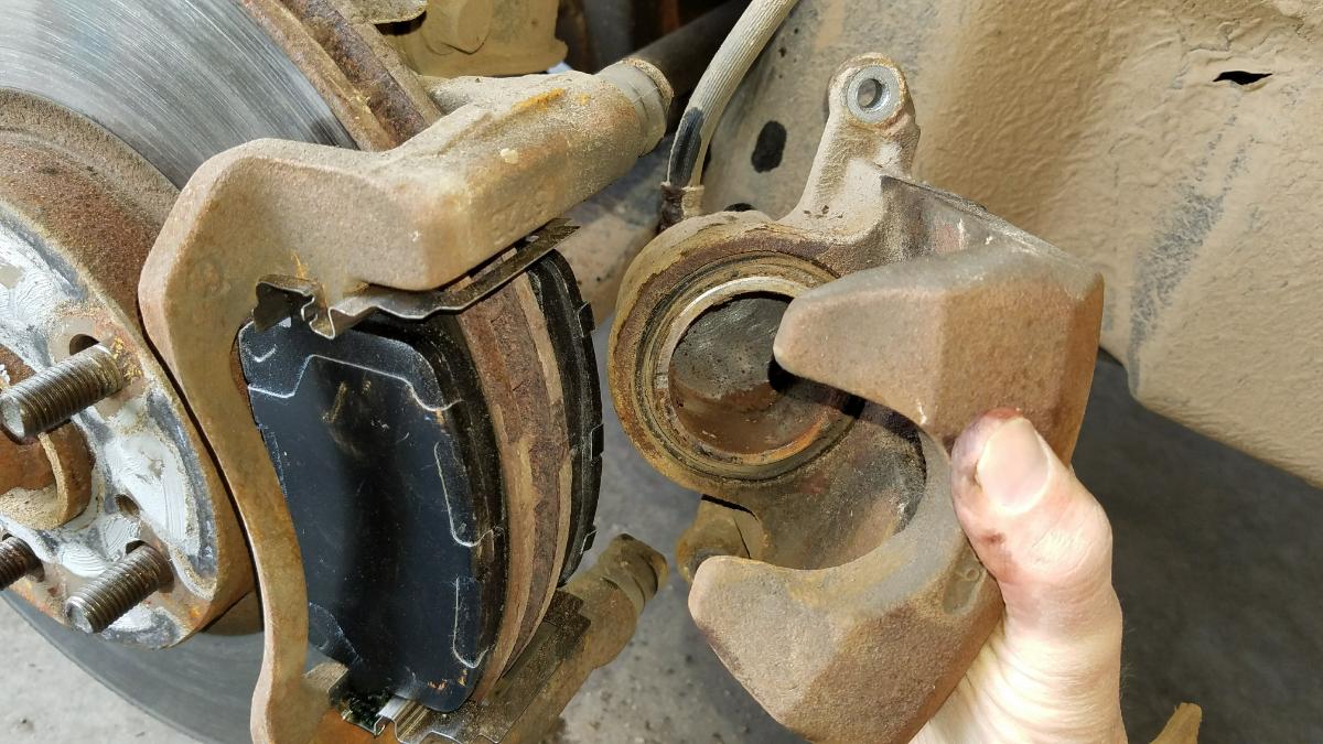 New Brake Pads being installed on a Toyota Corolla