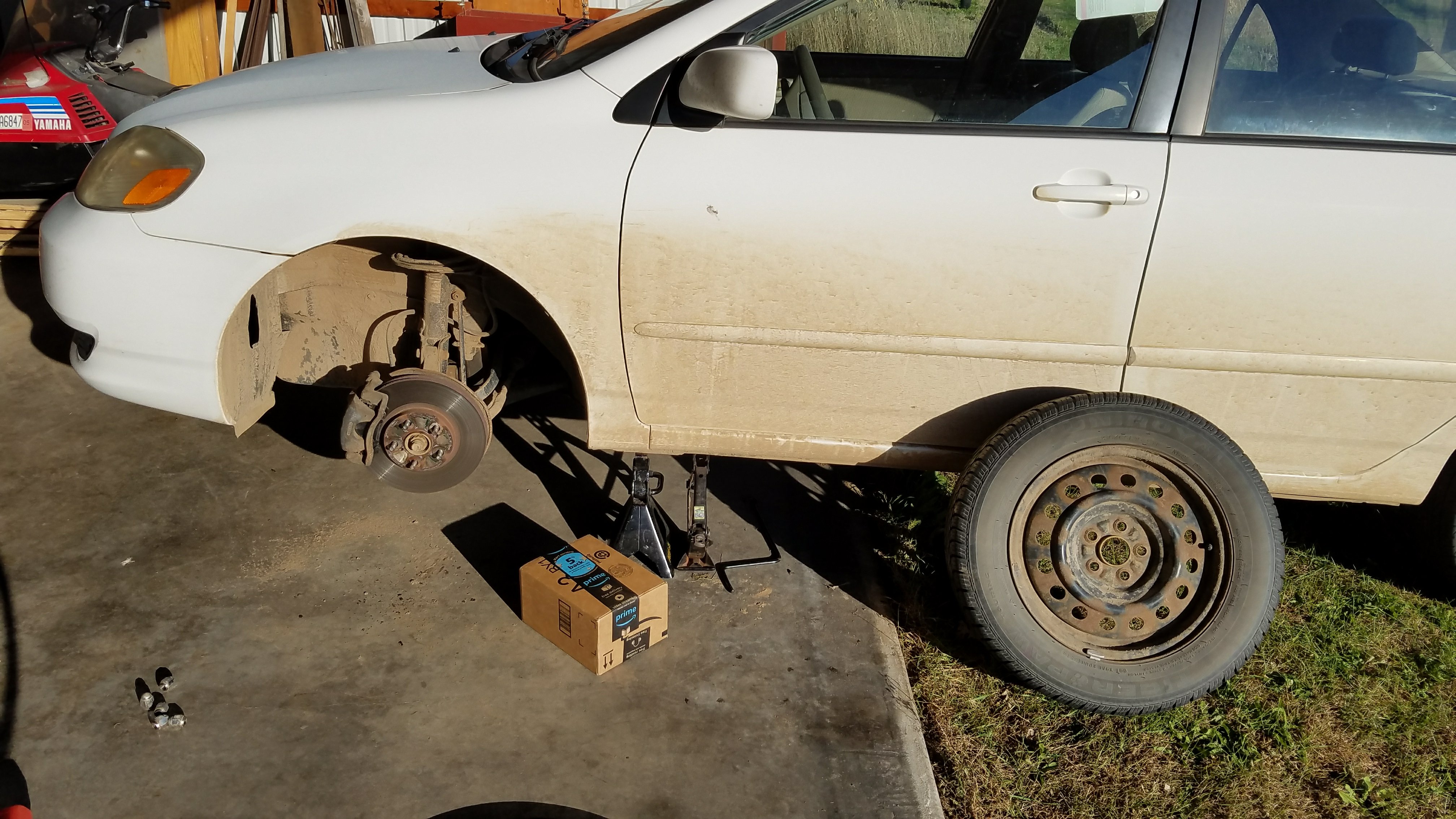 2004 corolla with the front tire removed.