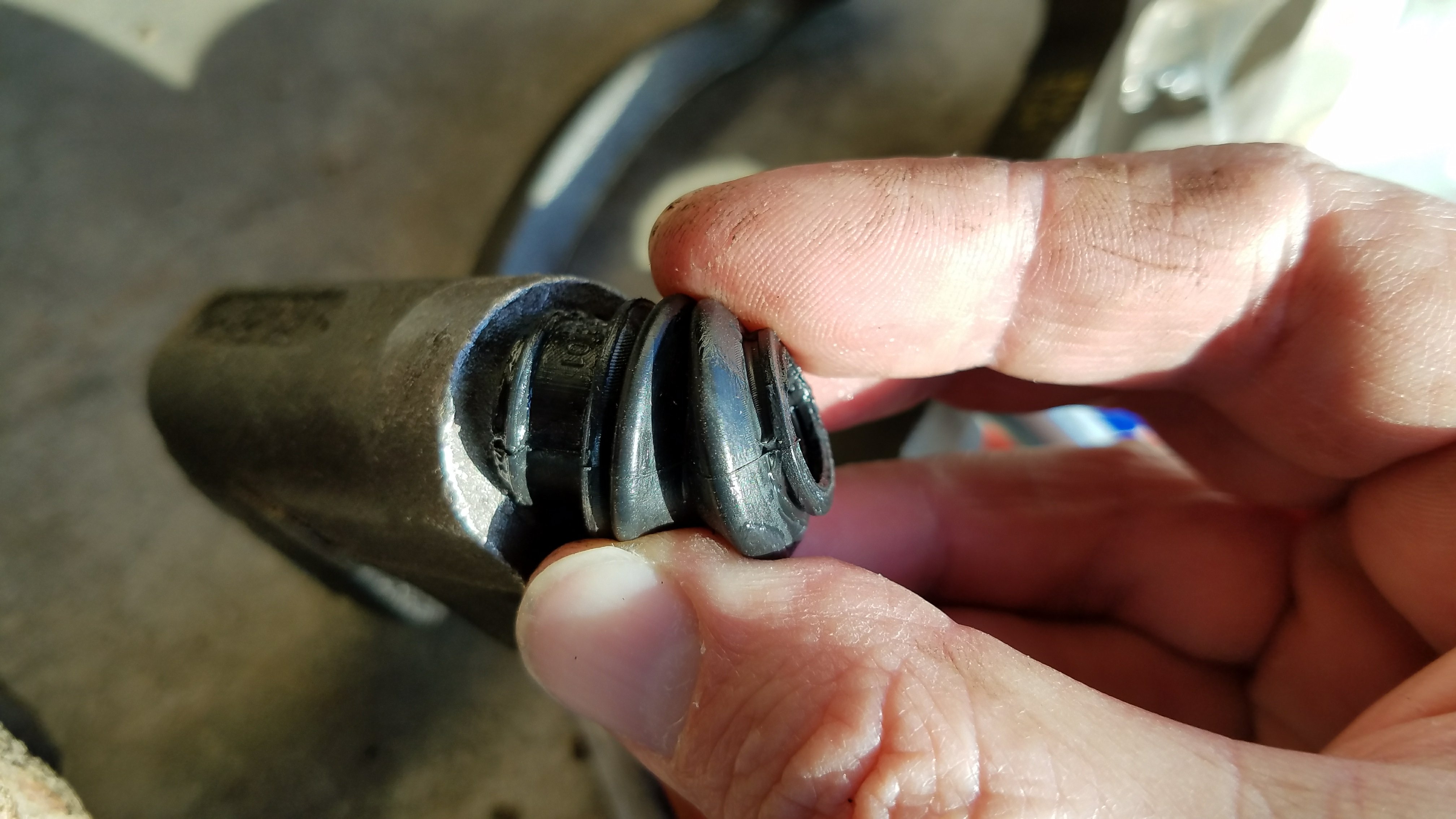Caliper pin boot installation.