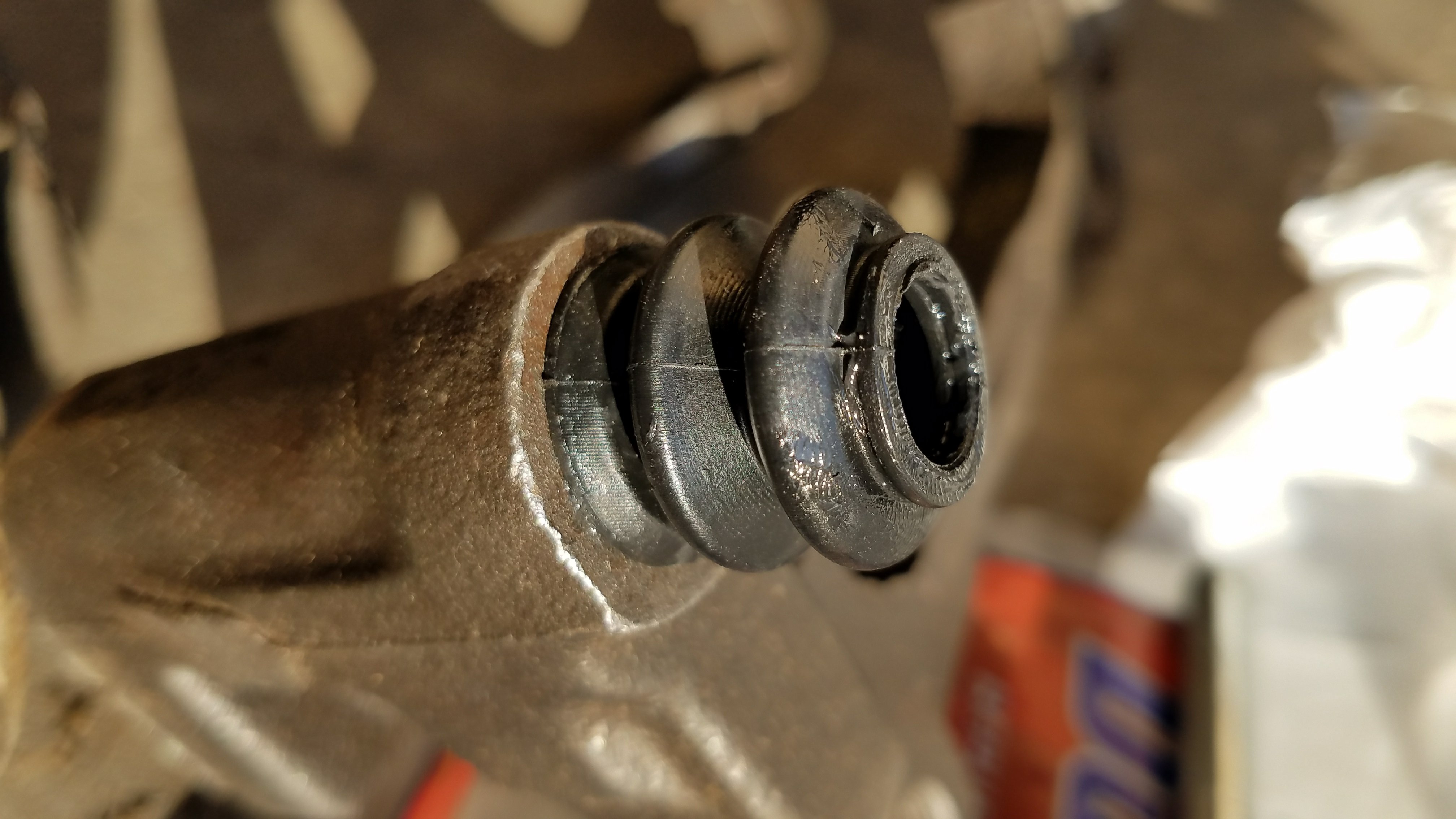 Install the boot into the bracket.
