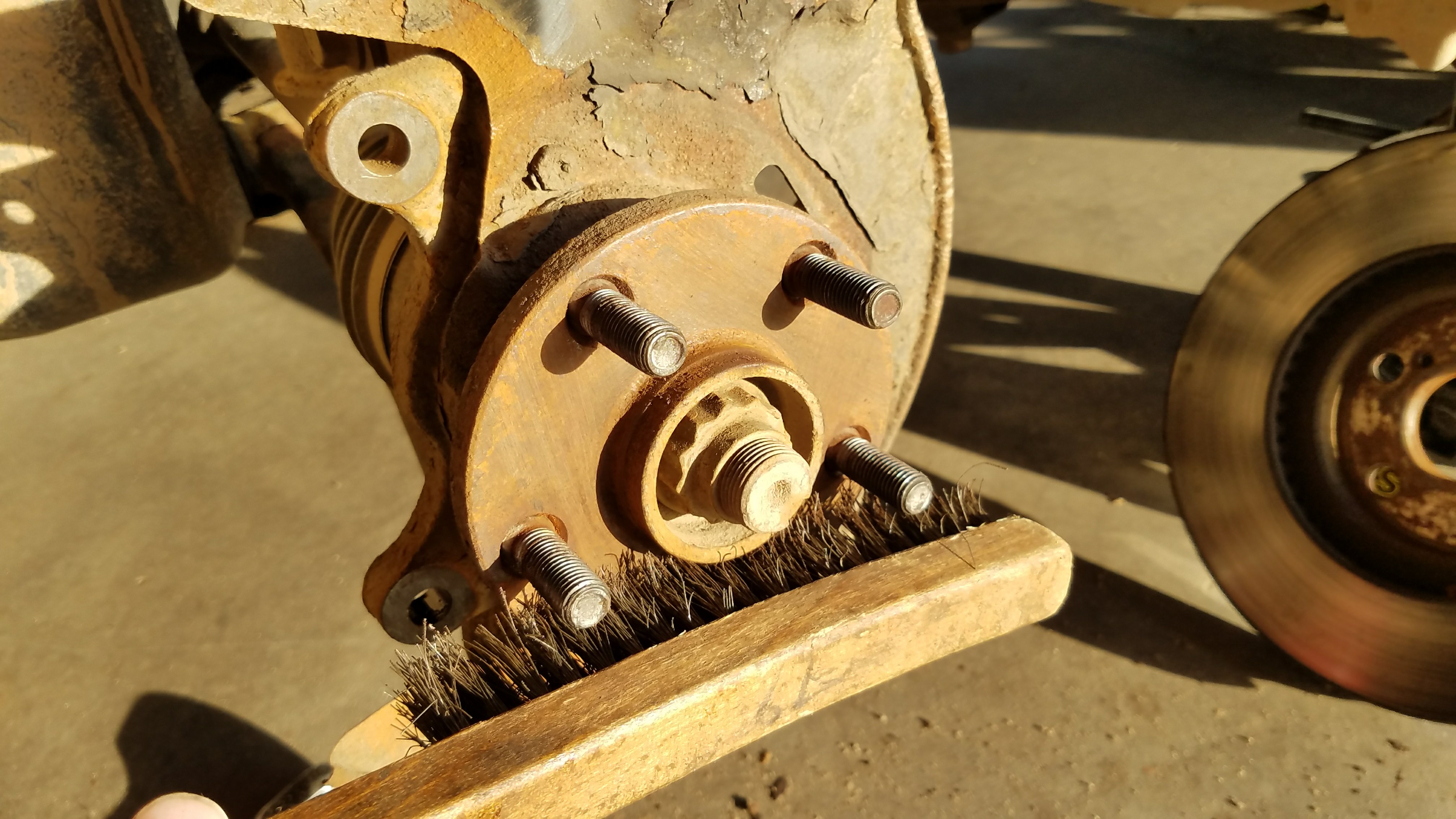 Wire brush the hub to remove rust.