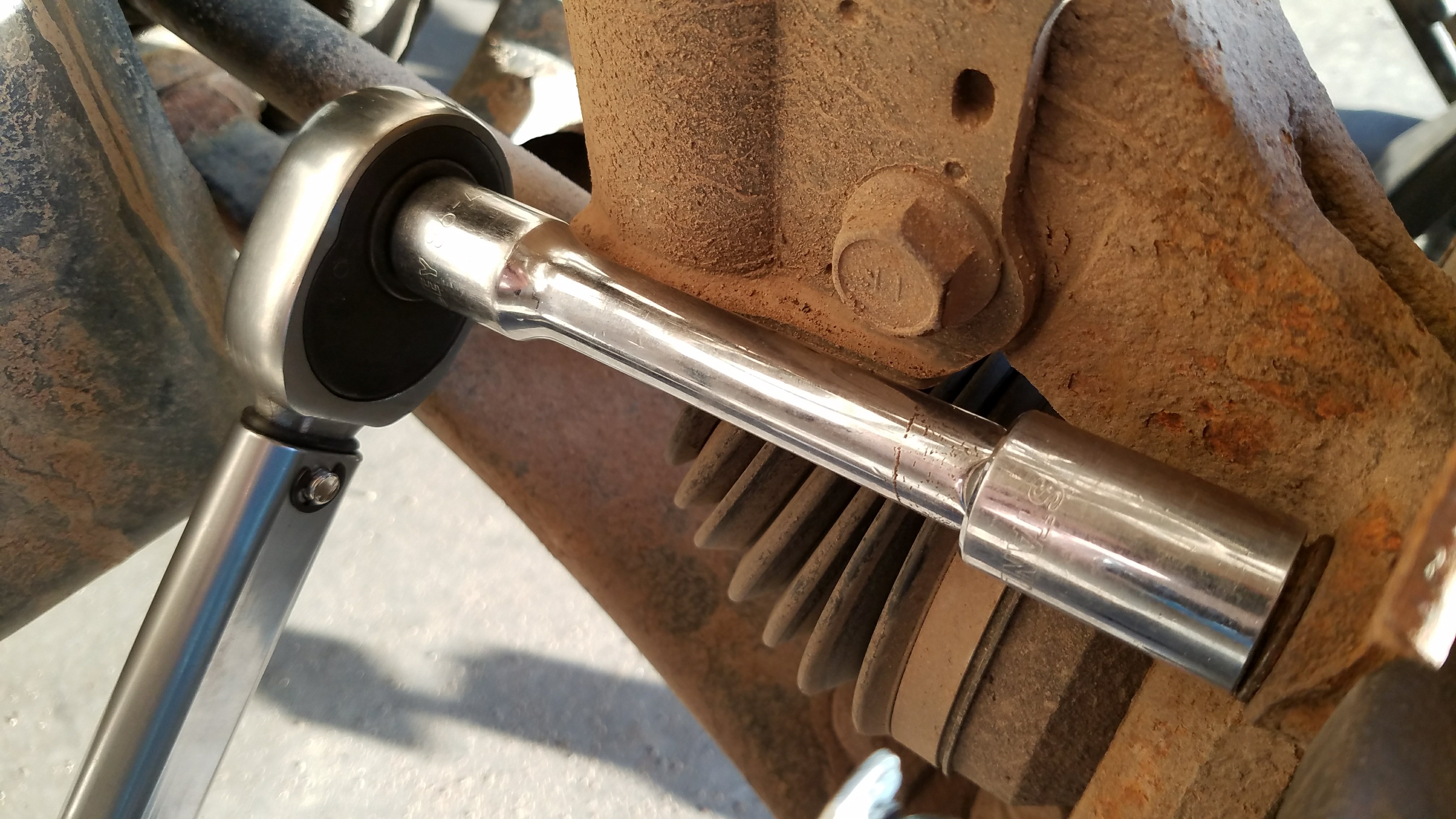 Tighten the top bolt.