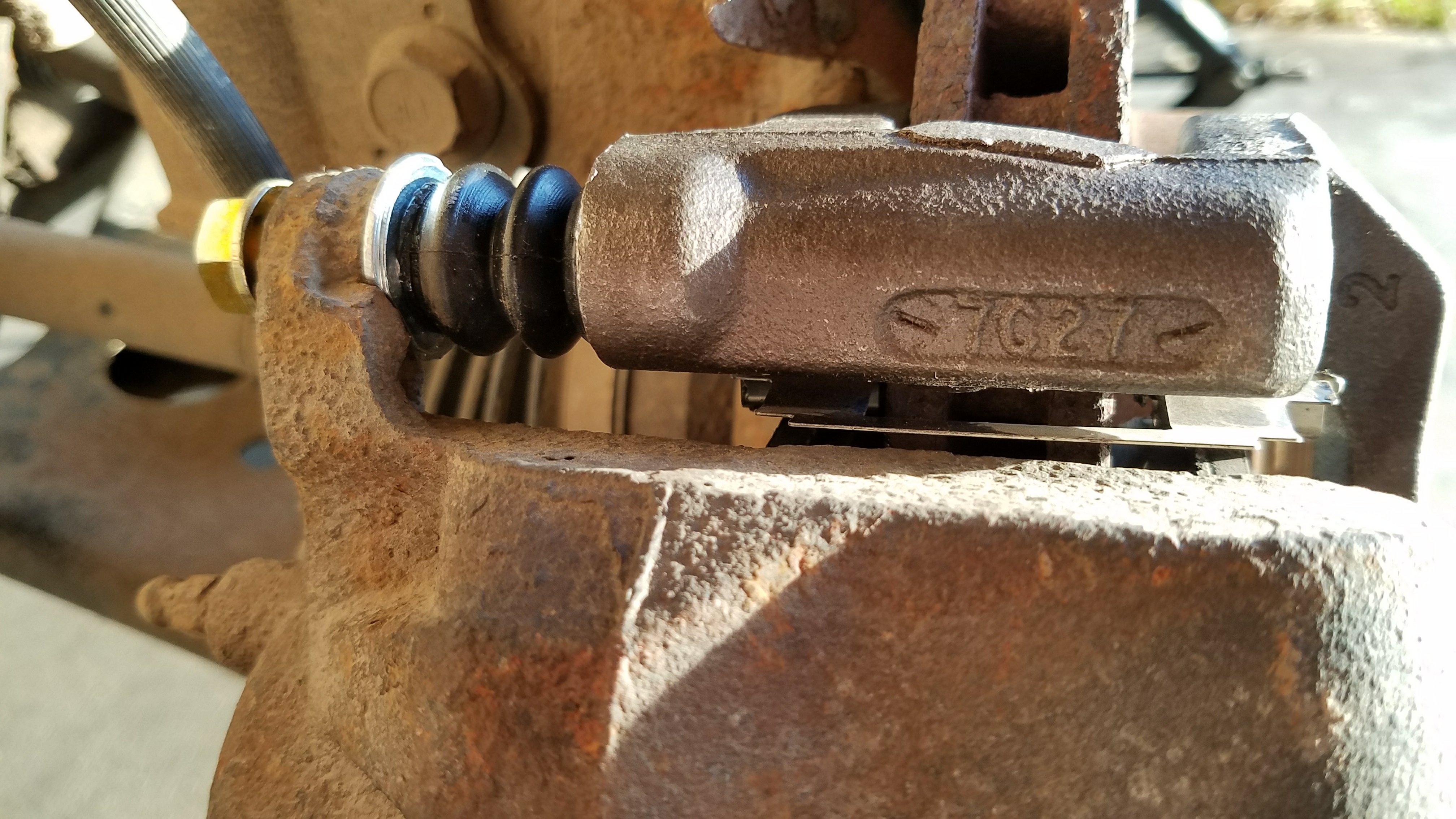 The top caliper mounting bolt.