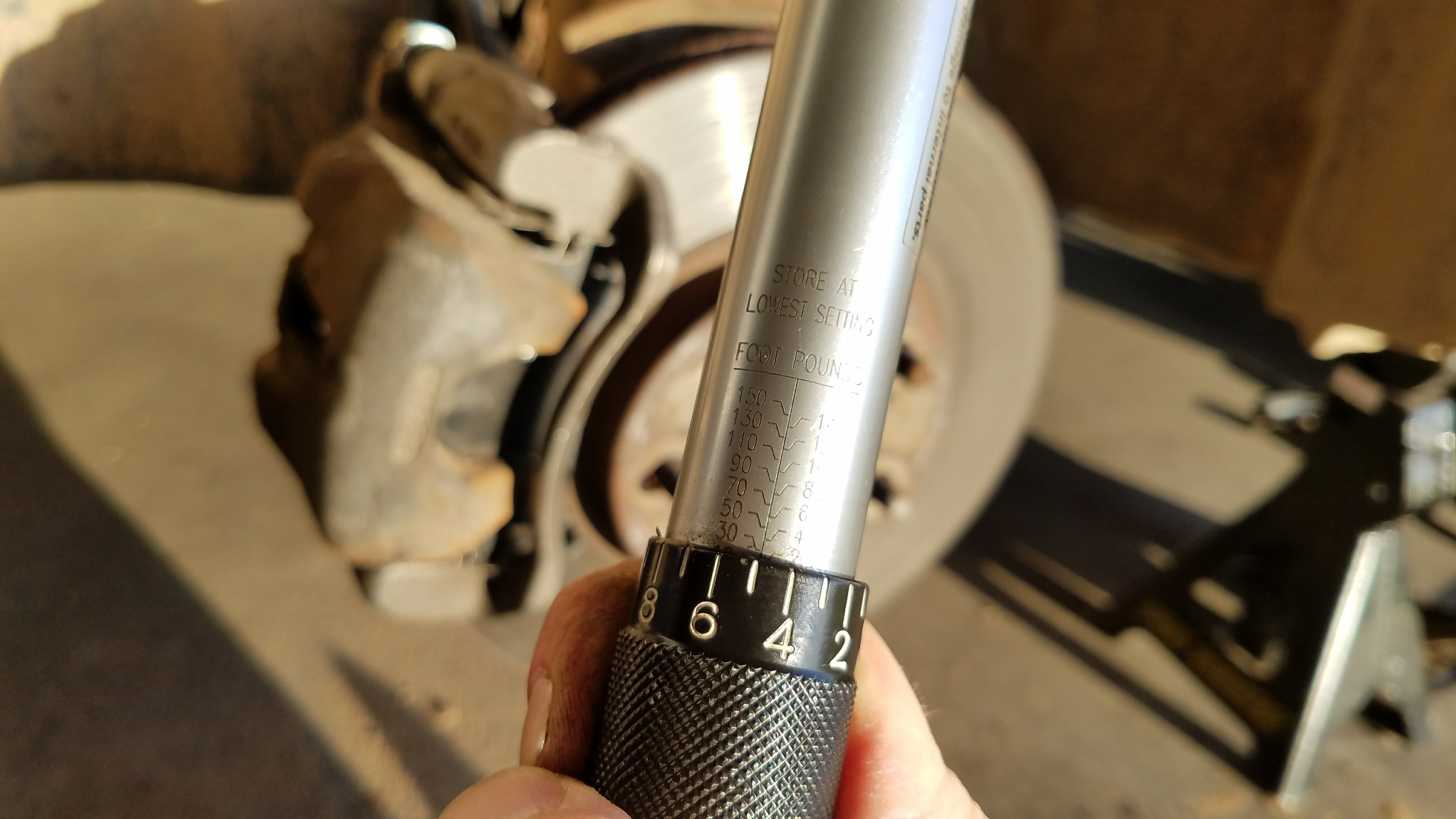 Torque the caliper bracket appropriately.
