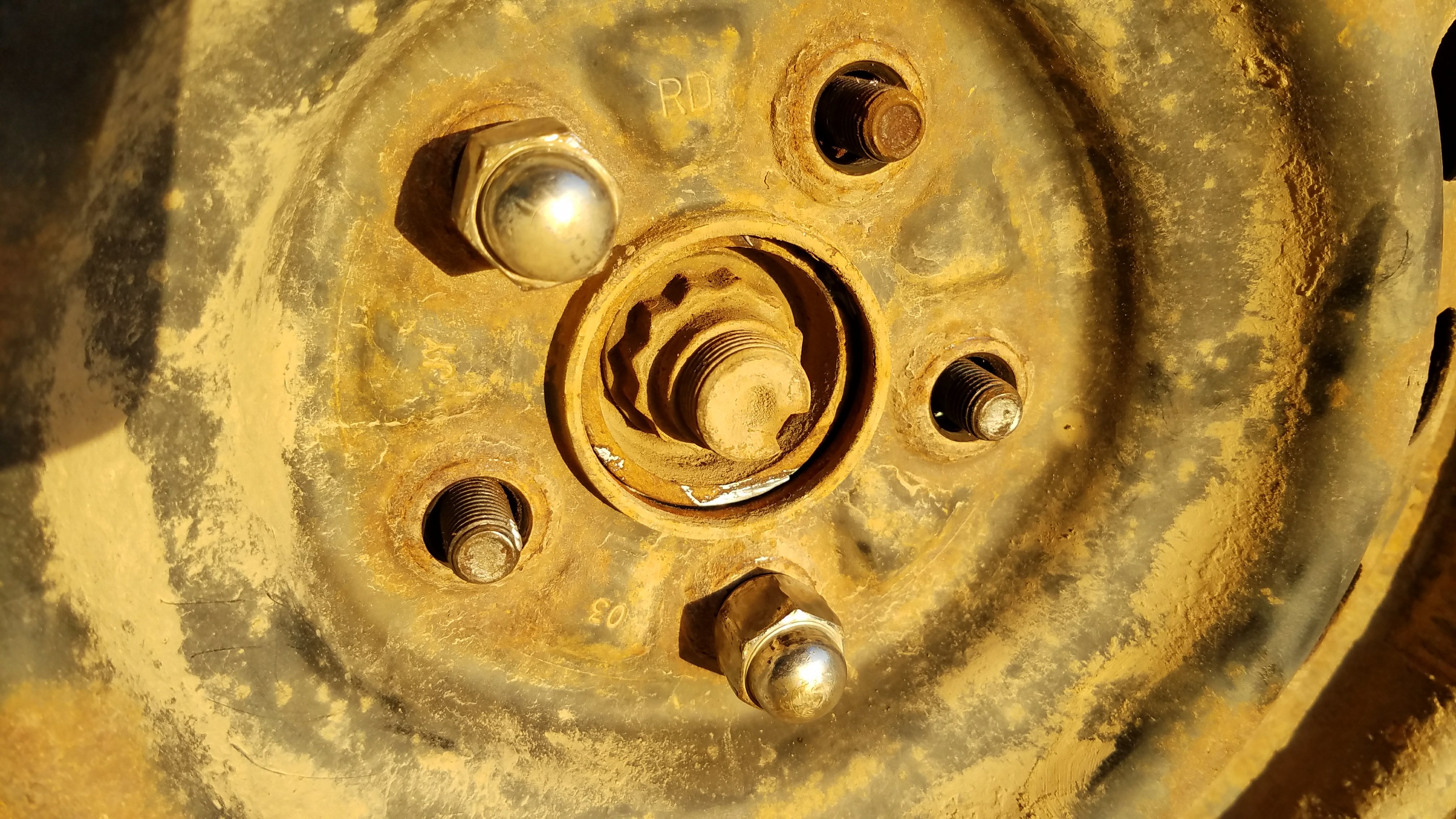 The lug nuts removed.