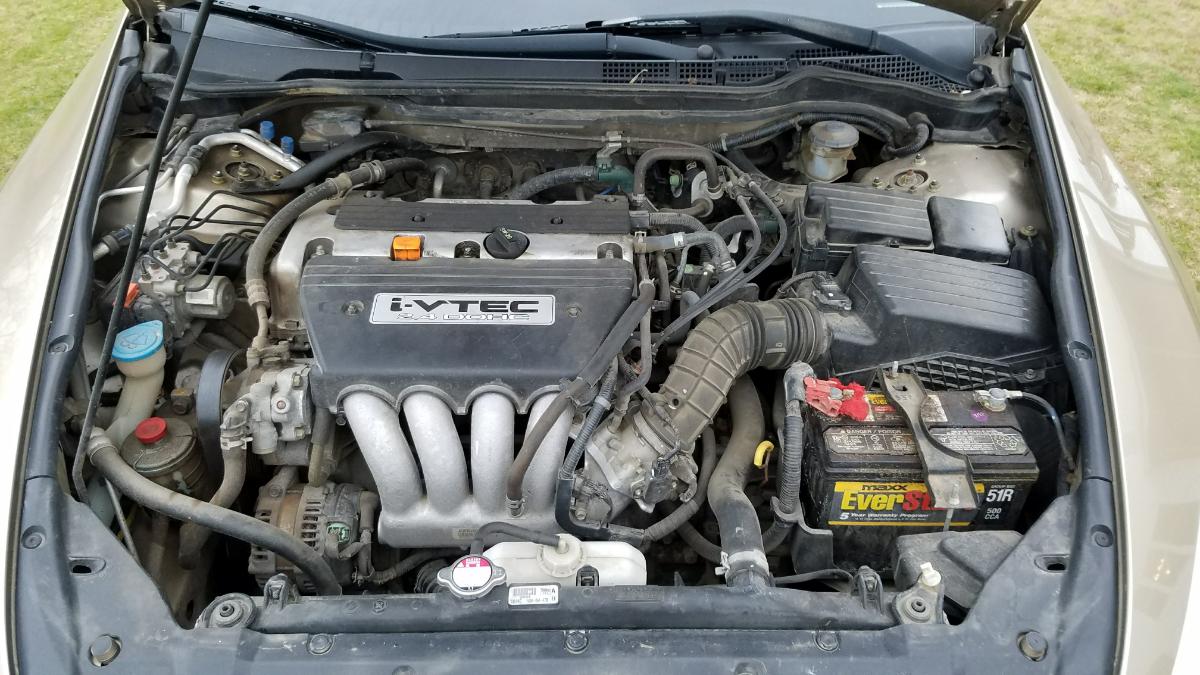 The engine bay of a 2004 Honda Accord