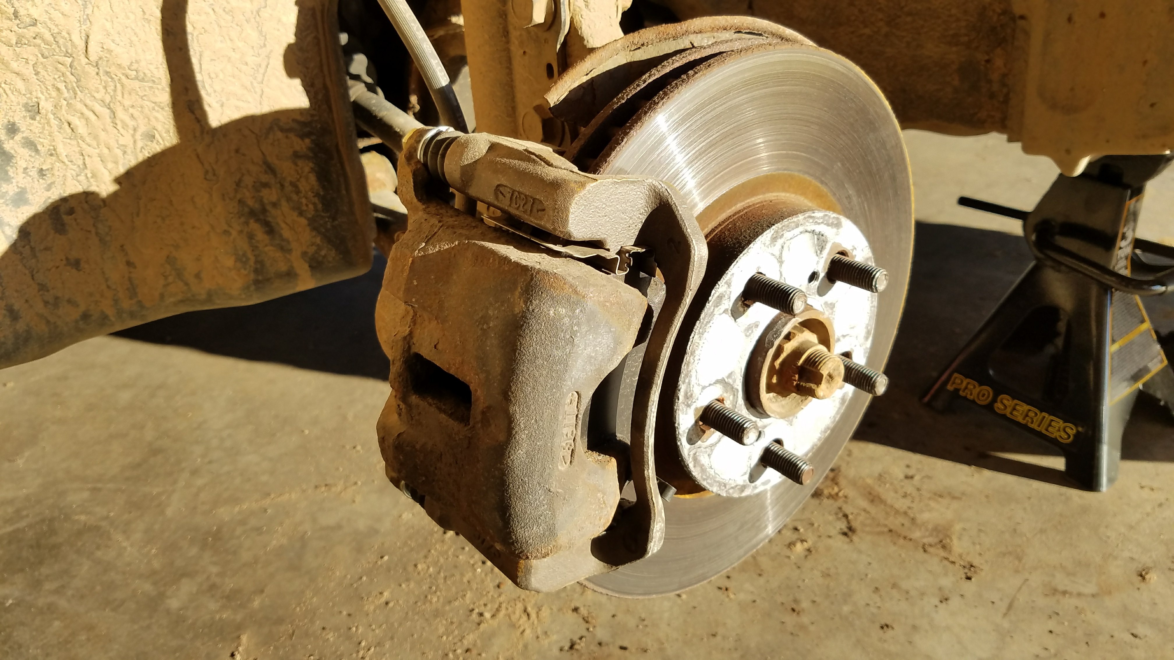 Rotor and brake caliper before removal.