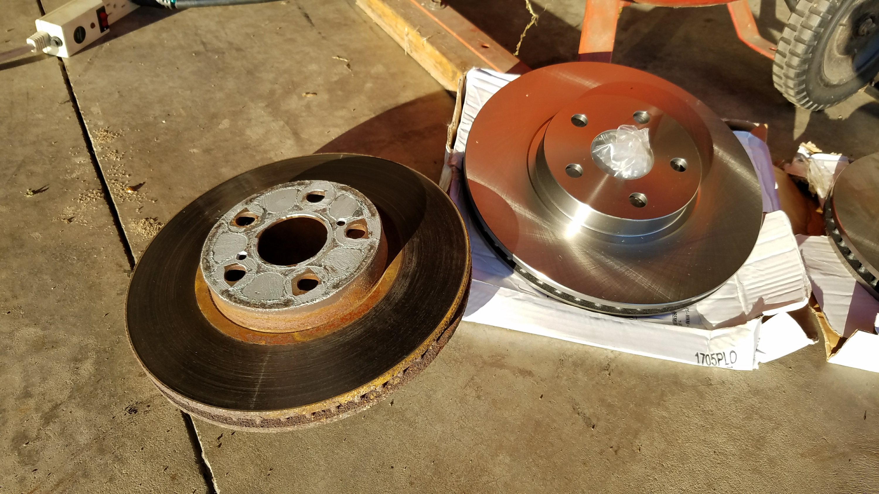 Side by side, the old and new corolla brake rotors