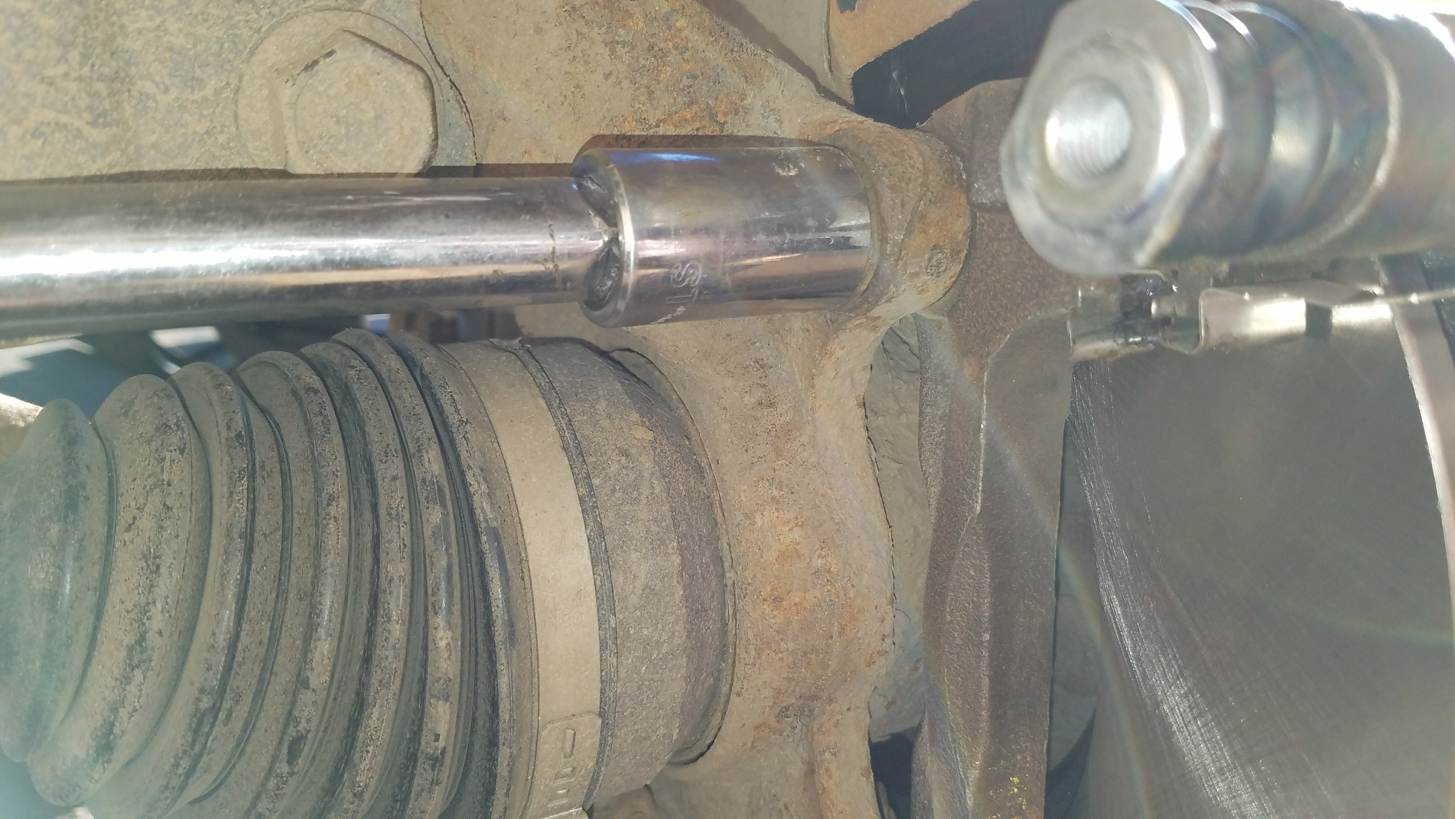 removing the caliper bracket mounting bolts