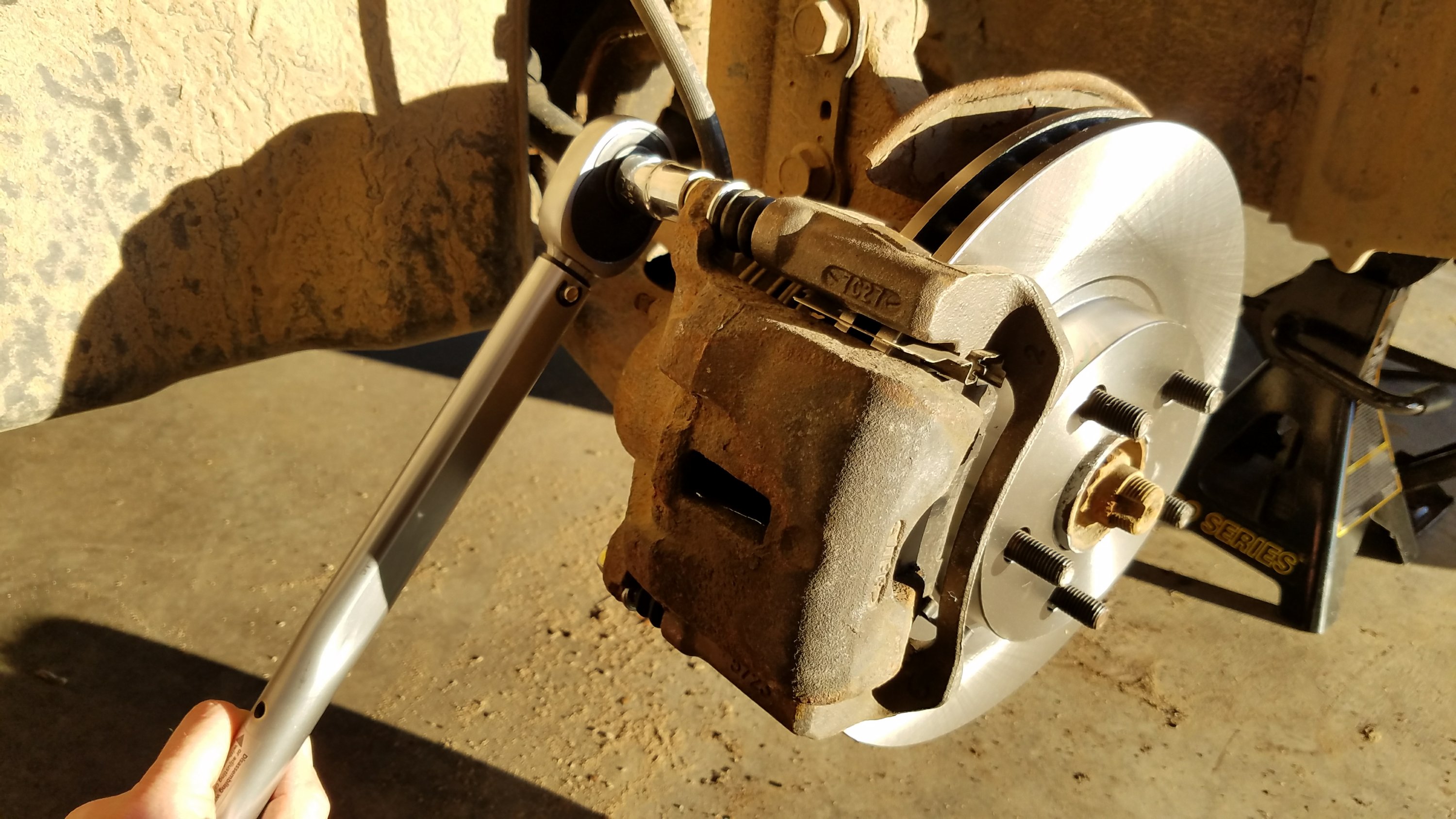 torque the caliper bracket mounting bolts