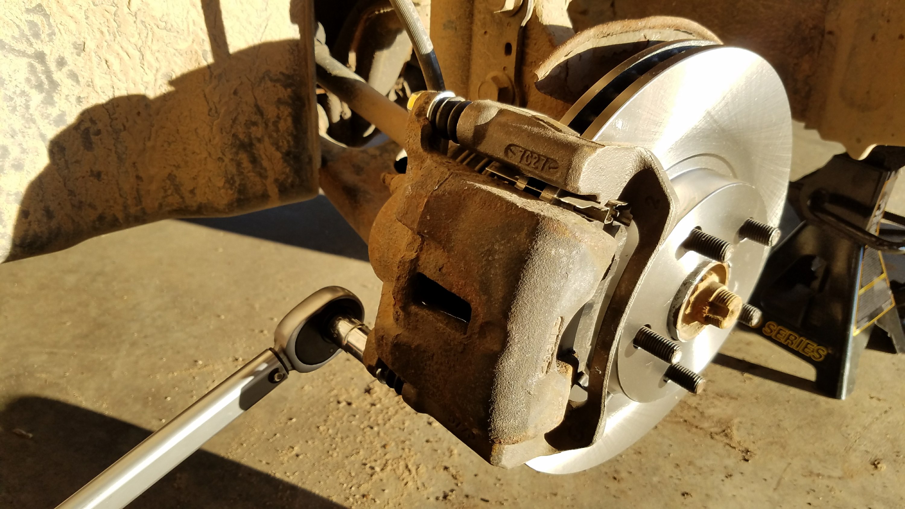 Use a torque wrench to tighten the brake caliper mounting bolts.