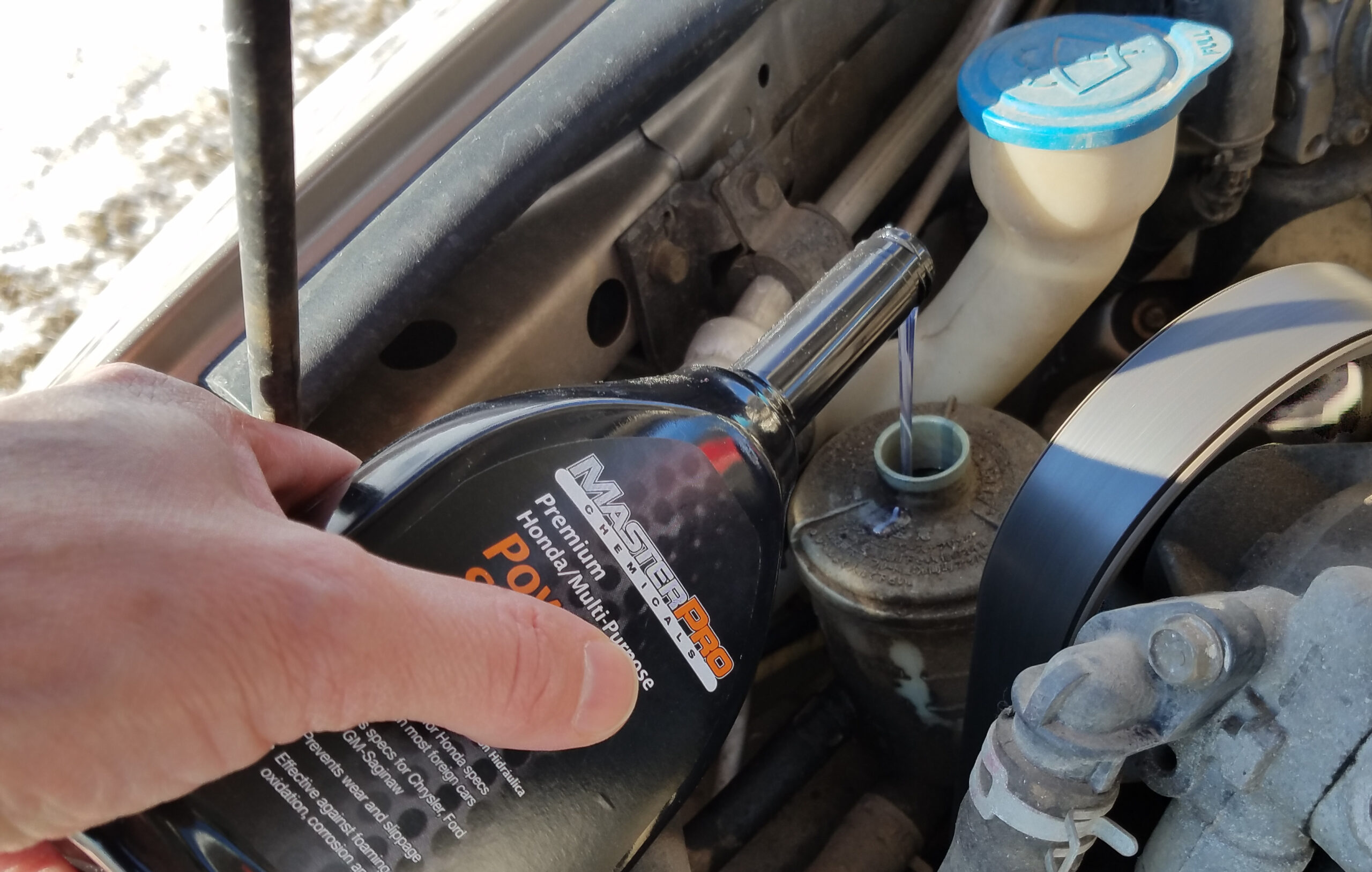 adding power steering fluid
