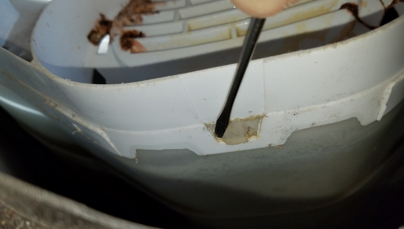 unclip the plastic tabs