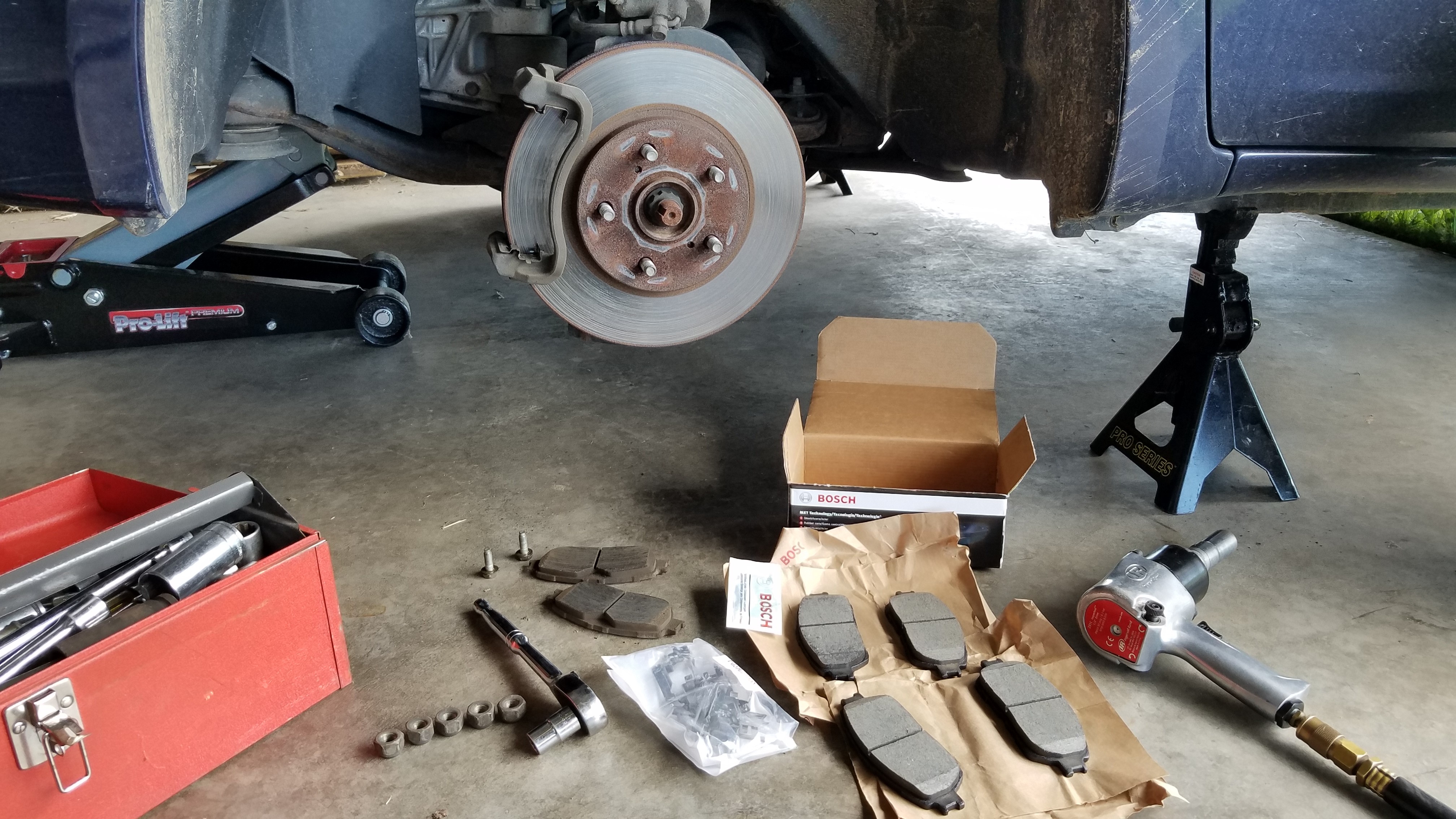 017-old-brake-pads-removed-with-new-brake-pads