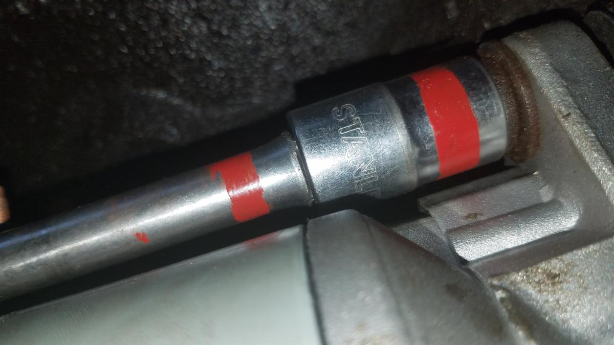 032-tighten-upper-starter-bolt