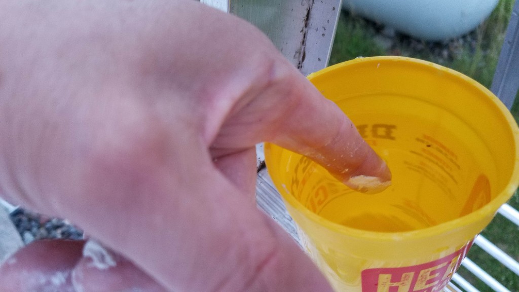 03b-wet-finger-to-smooth-caulking