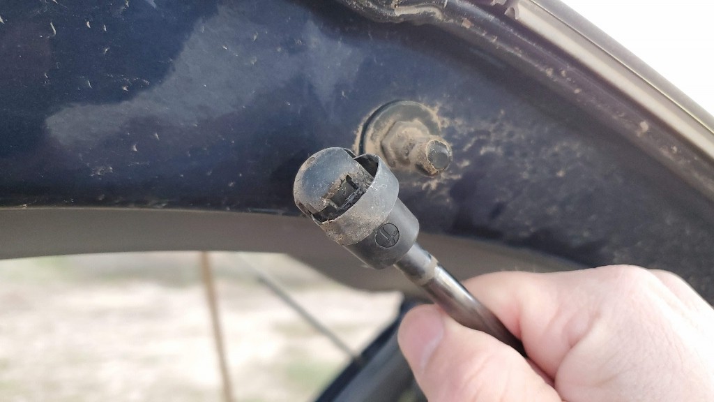 Toyota Sienna old liftgate strut removed (pulled off).