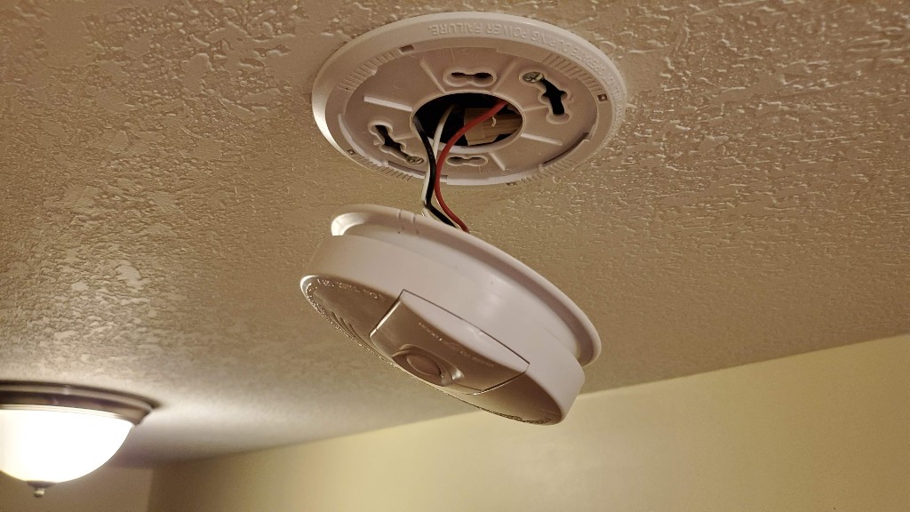 smoke-alarm-dangling-from-wire-harness