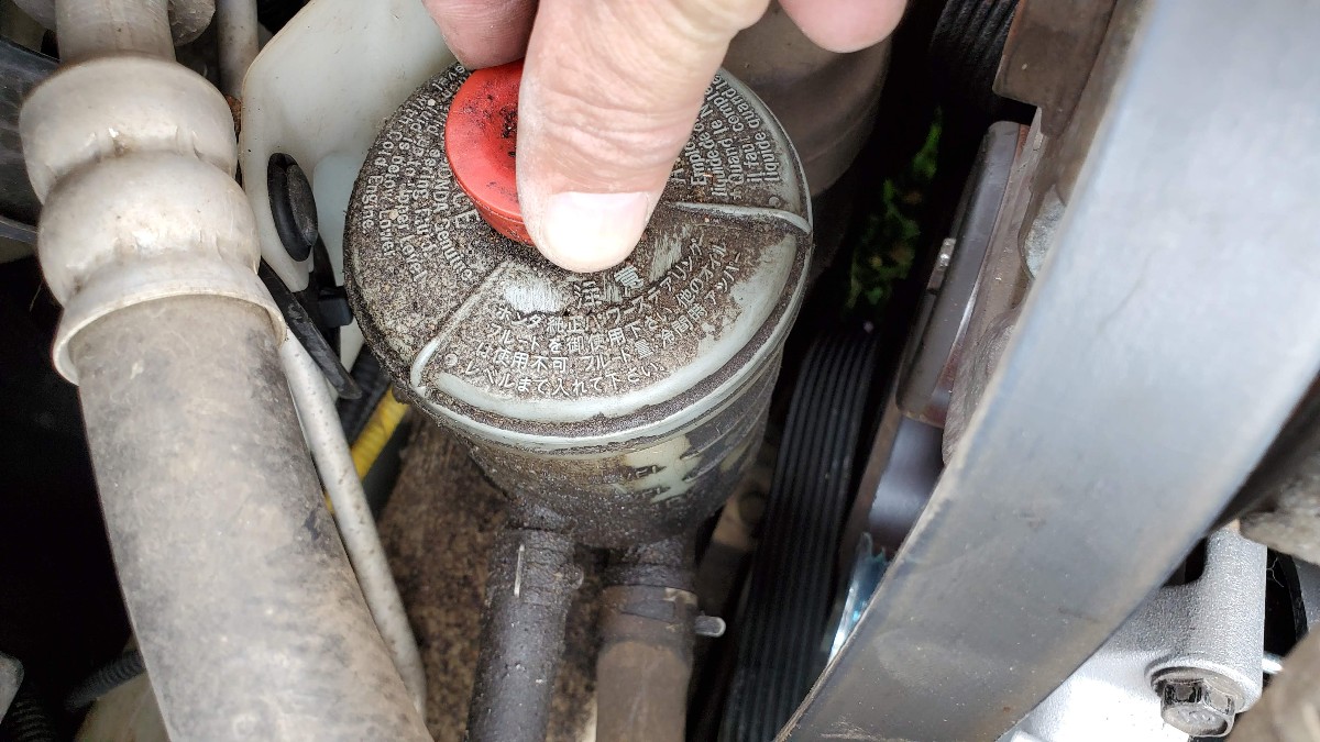 Re-seat power steering reservoir cap