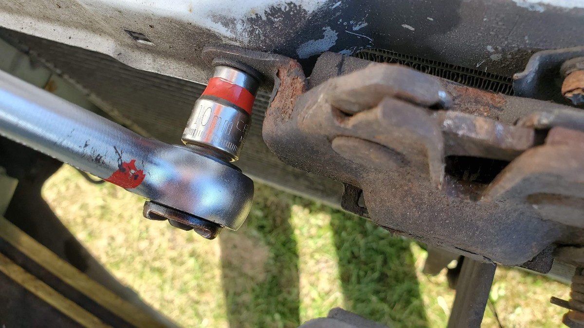 07-remove-10mm-bolts-hood-latch-Toyota-Corolla