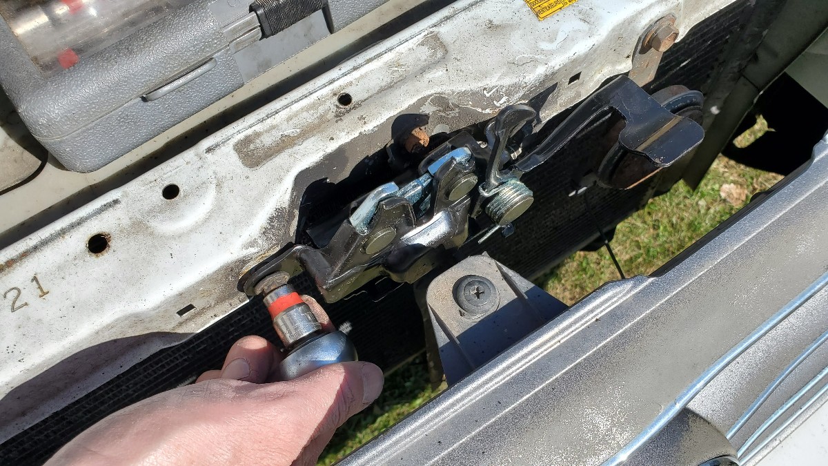 11-install-new-hood-latch-mechanism-Toyota-Corolla