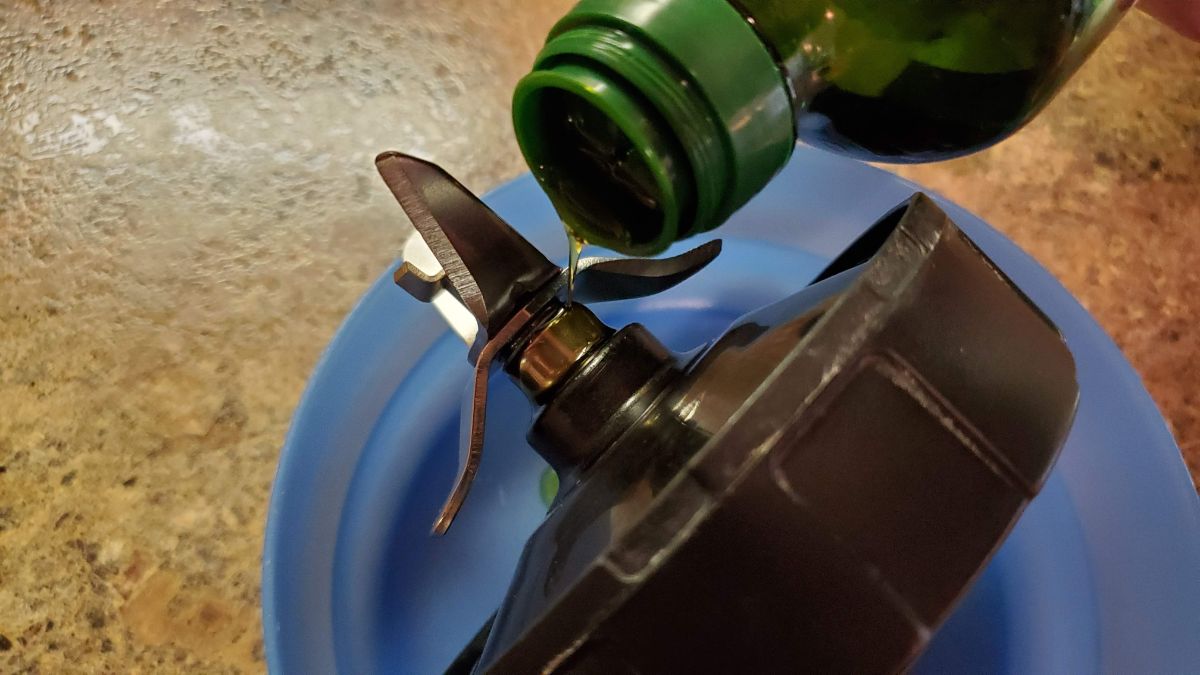 Pour olive oil around the blade shaft.