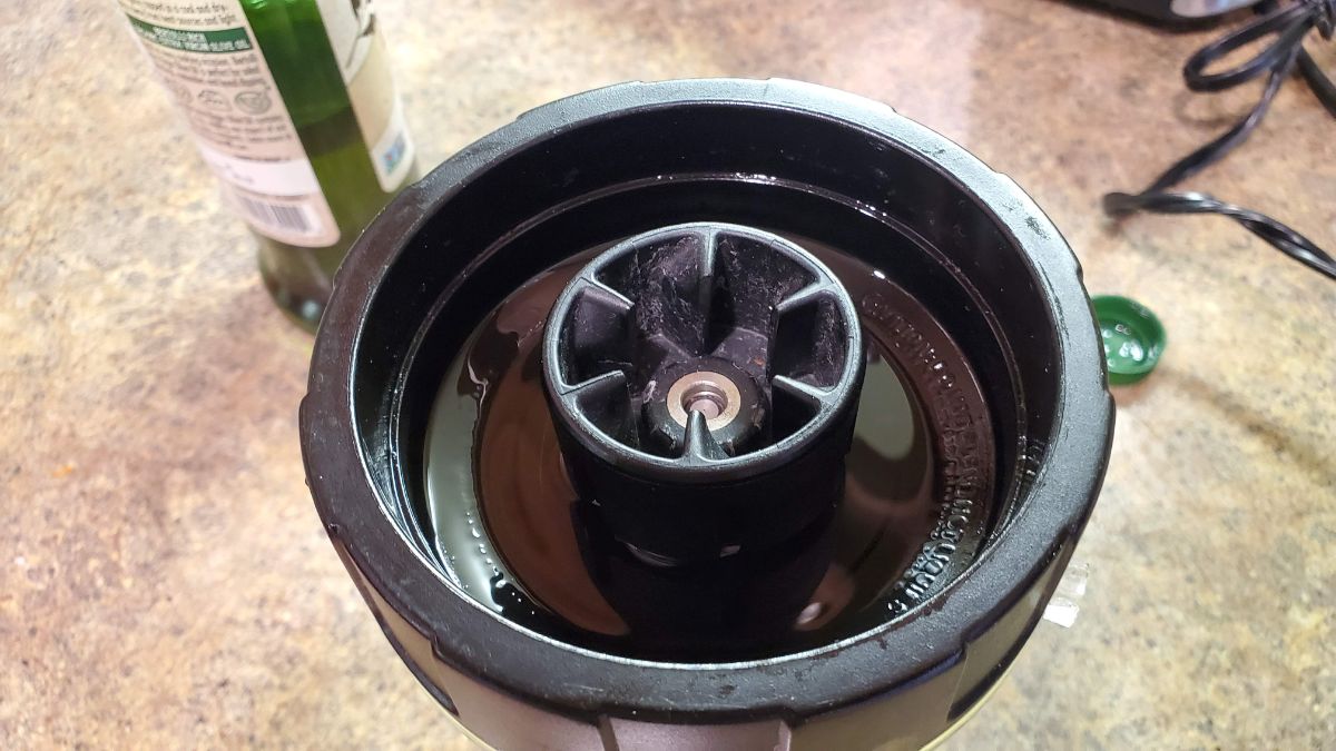 Keep the blade assembly inverted.