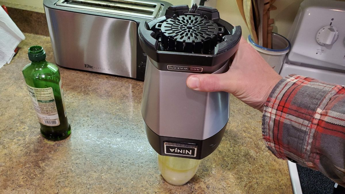 Place the blender motor onto the cup and blade assembly - upside down so that we don't lose oil!