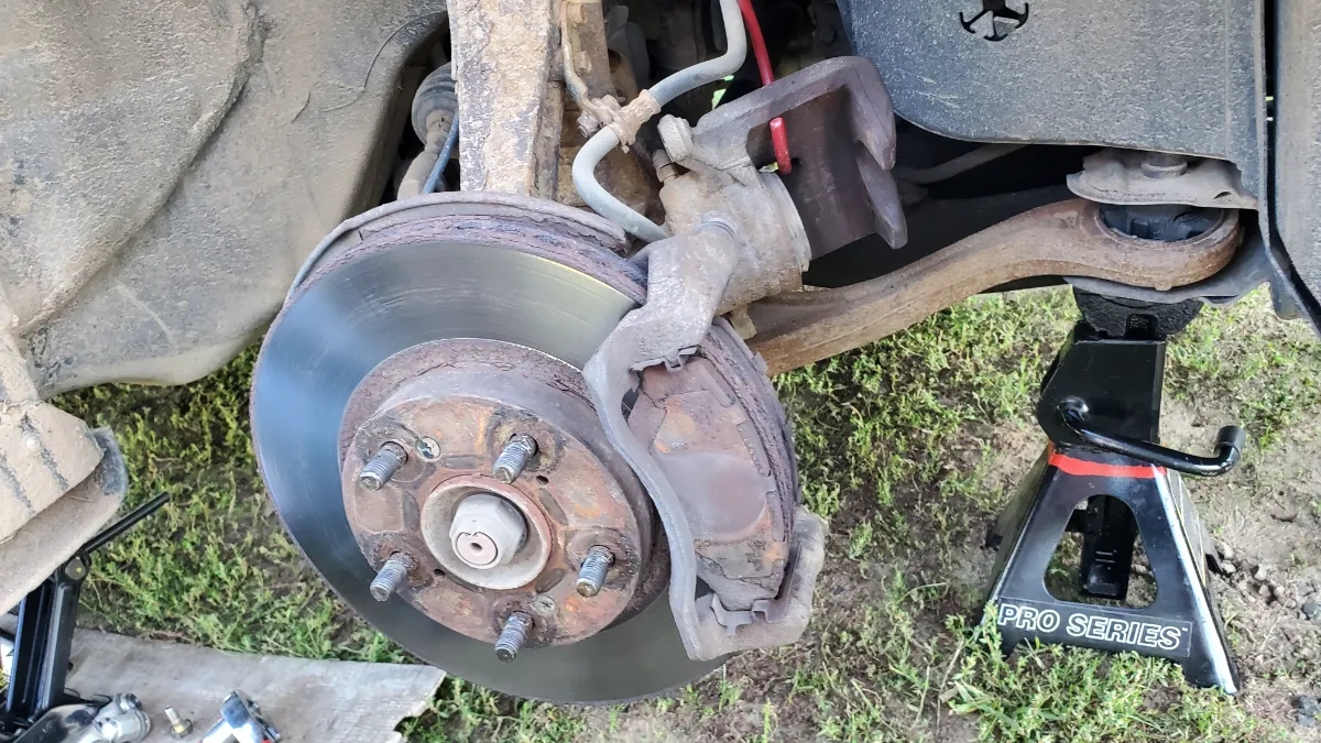 Honda Accord Caliper removed exposing brake pads