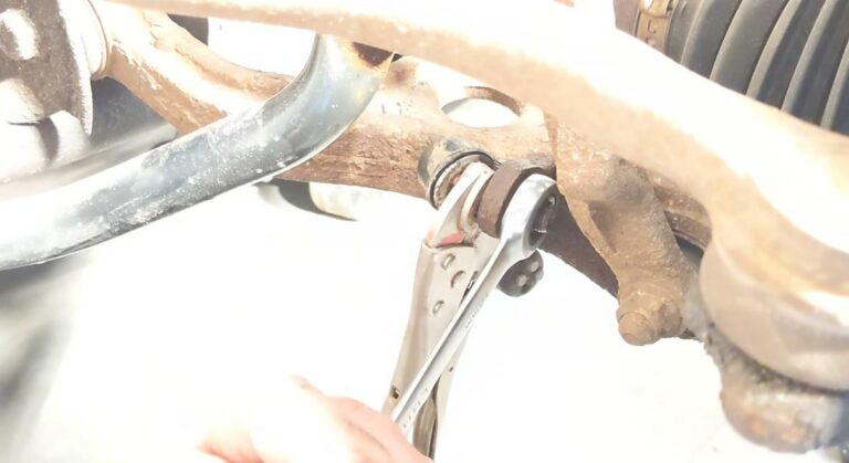 14mm wrench on a sway bar link with vice grip