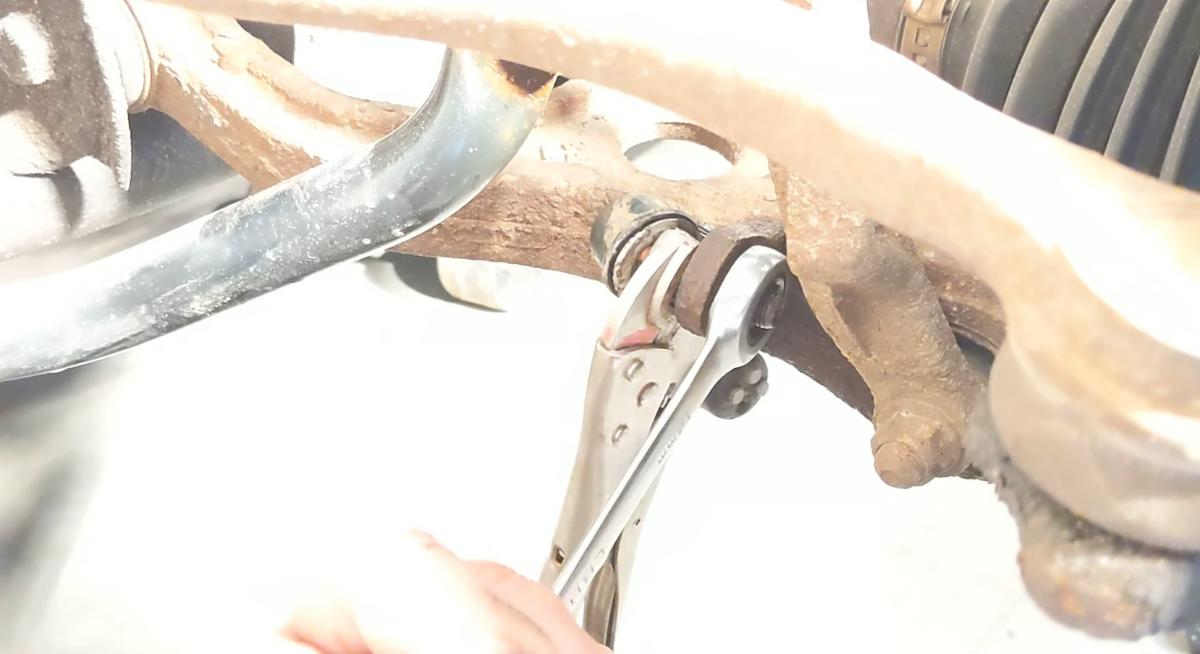 14mm wrench on a sway bar link with vice grip